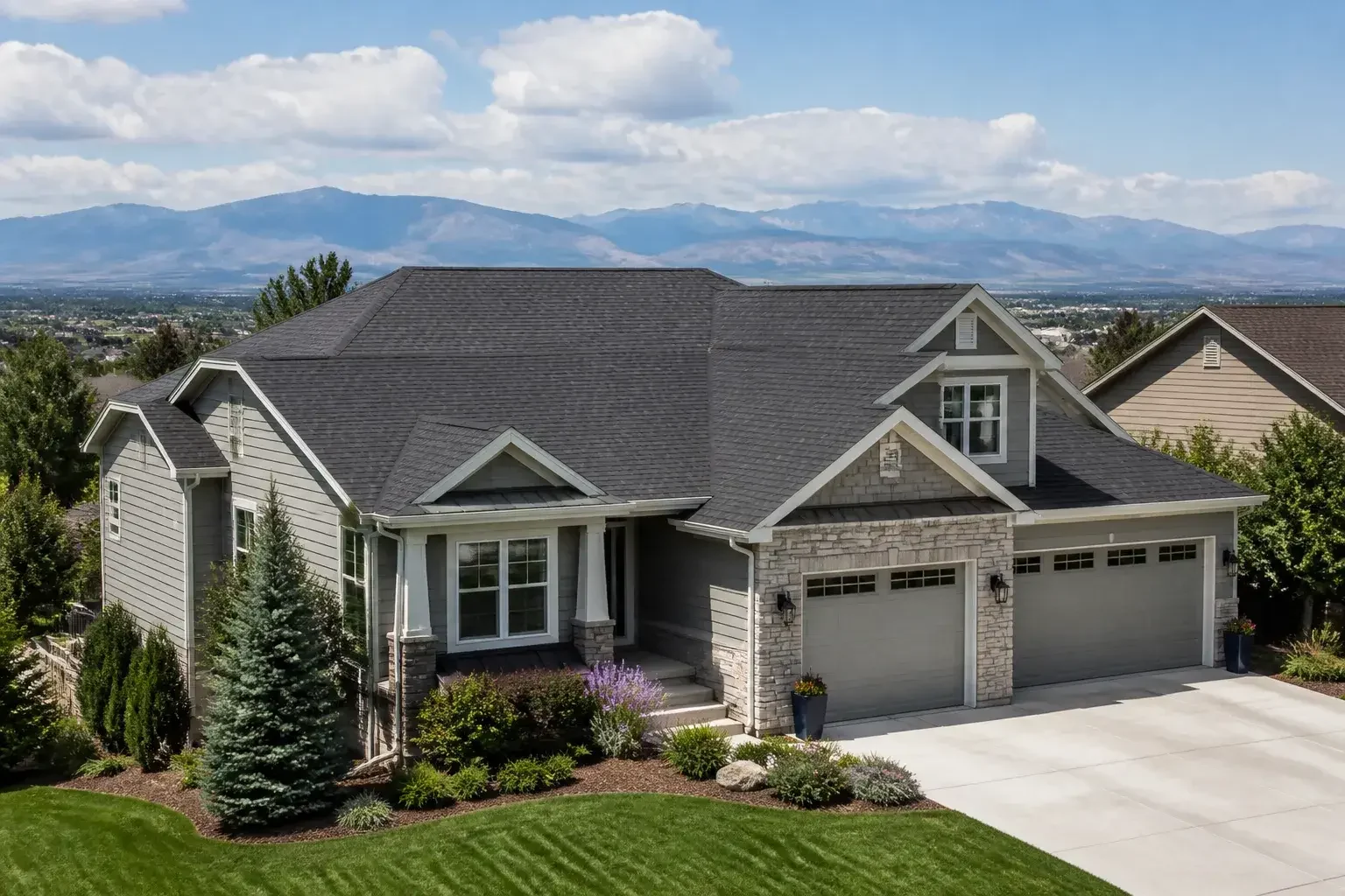 Finished Denver home with a new roof and mountains in the distance